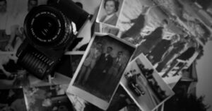 Collection of vintage photos with a retro camera, evoking nostalgia and memories.