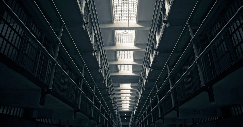 A low-angle view of Alcatraz prison cell block, showcasing steel railings.