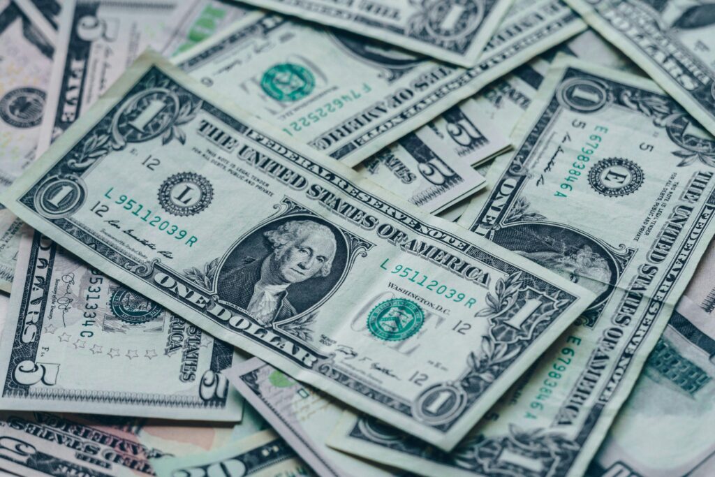 Close-up image of stacked US dollar bills representing wealth and finance.